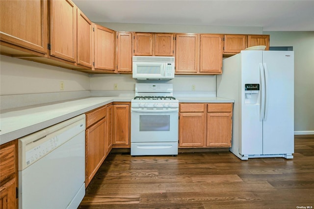 kitchen featuring dark hardwood / wood-style floors and white appliances