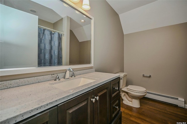 bathroom with baseboard heating, hardwood / wood-style floors, lofted ceiling, toilet, and vanity