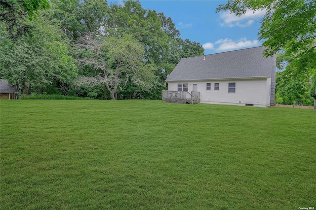 view of yard with a wooden deck