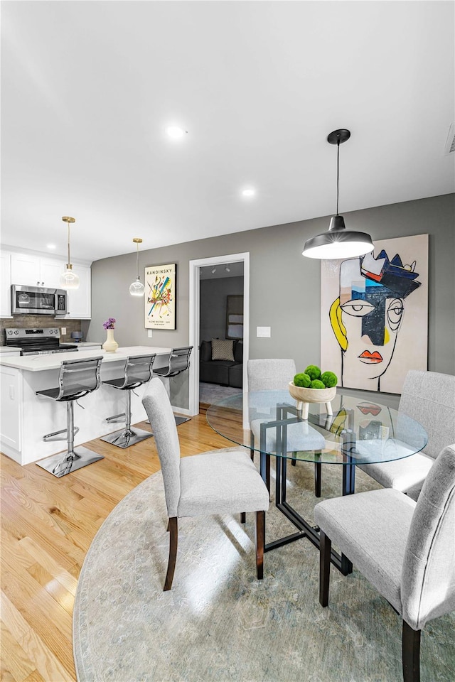 living room with light hardwood / wood-style flooring