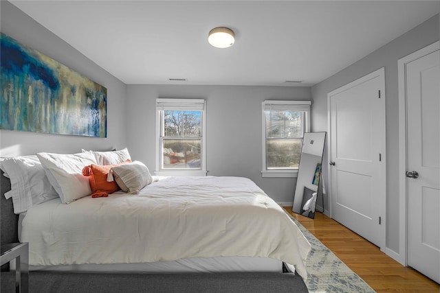 bedroom with wood-type flooring