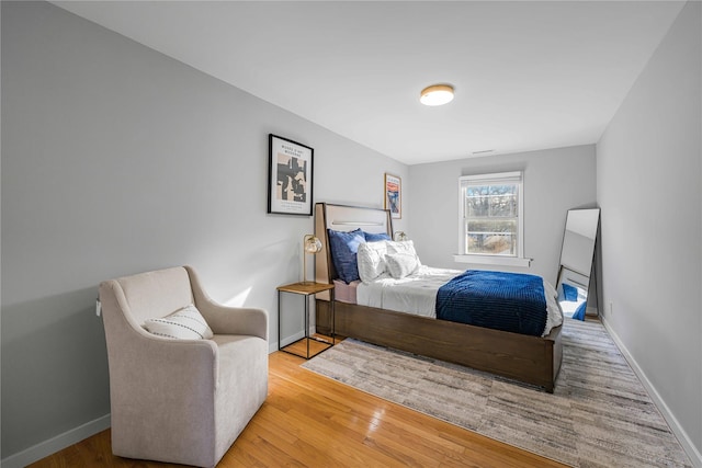 bedroom with light hardwood / wood-style flooring