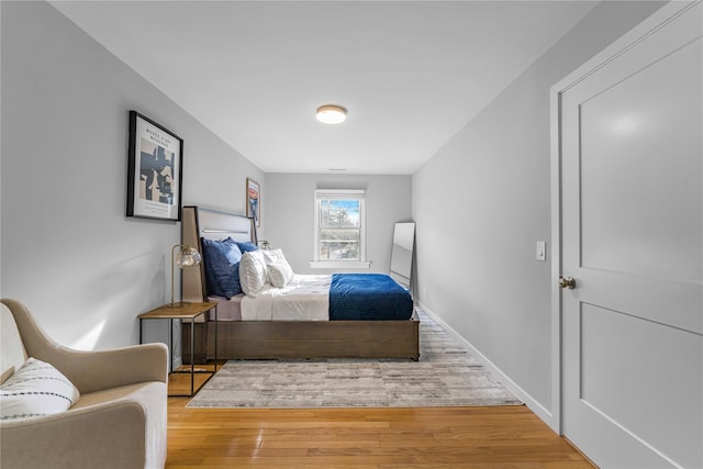 bedroom with hardwood / wood-style flooring