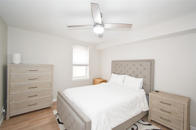 bedroom with ceiling fan and light hardwood / wood-style floors