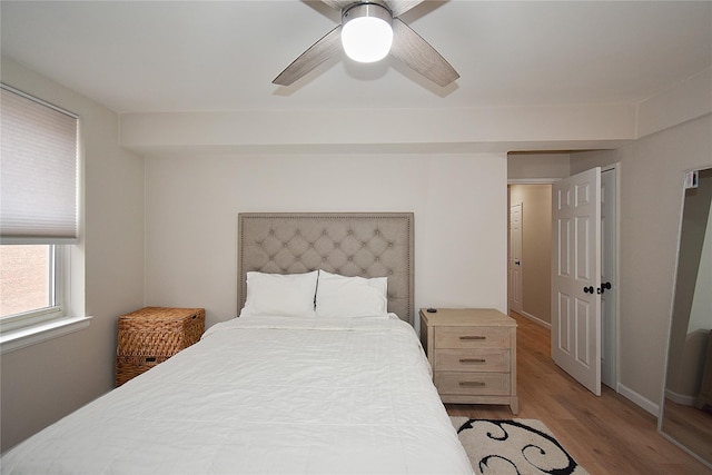 bedroom featuring ceiling fan and light hardwood / wood-style flooring