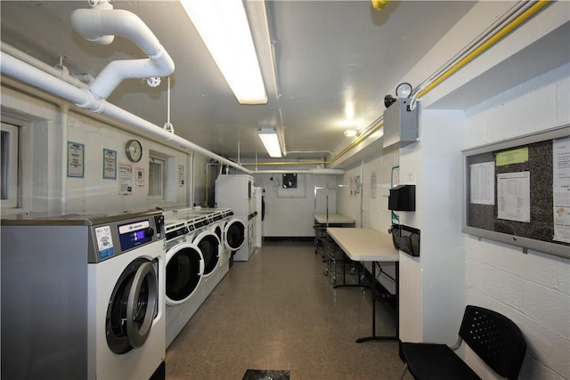 laundry area with independent washer and dryer