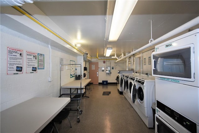 laundry area with washing machine and clothes dryer and stacked washing maching and dryer