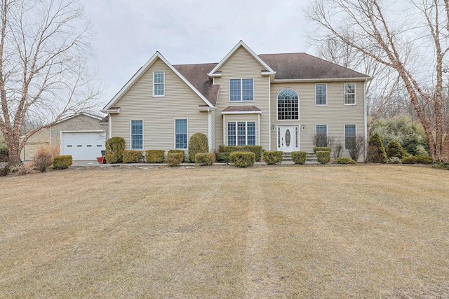 view of front facade featuring a garage and a front lawn