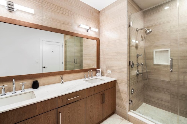 bathroom with vanity, tile patterned flooring, and a shower with door