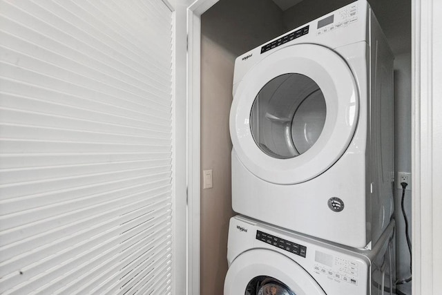 laundry room featuring stacked washer and dryer