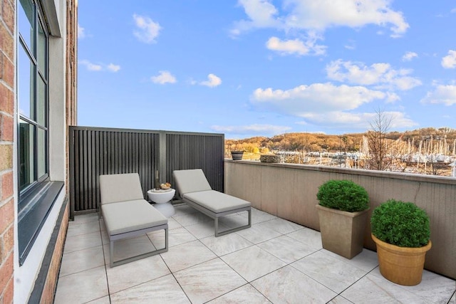 view of patio featuring a balcony