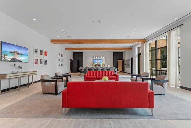 living room with light wood-type flooring and beamed ceiling