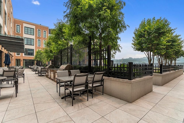 view of patio / terrace featuring a mountain view and area for grilling