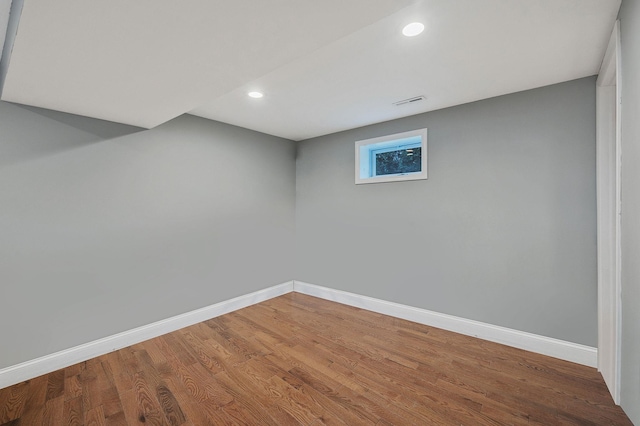 basement with wood-type flooring