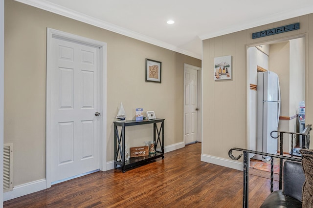 corridor featuring crown molding and dark wood-type flooring