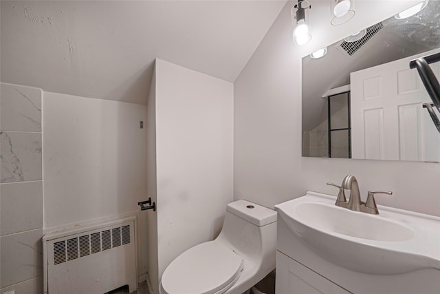 bathroom with toilet, radiator heating unit, lofted ceiling, and vanity