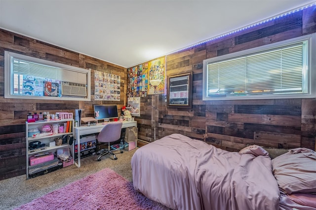 carpeted bedroom with wood walls