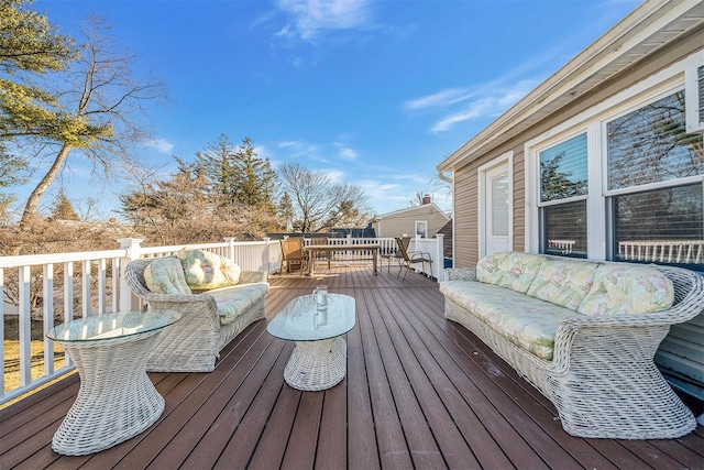 wooden terrace featuring an outdoor hangout area