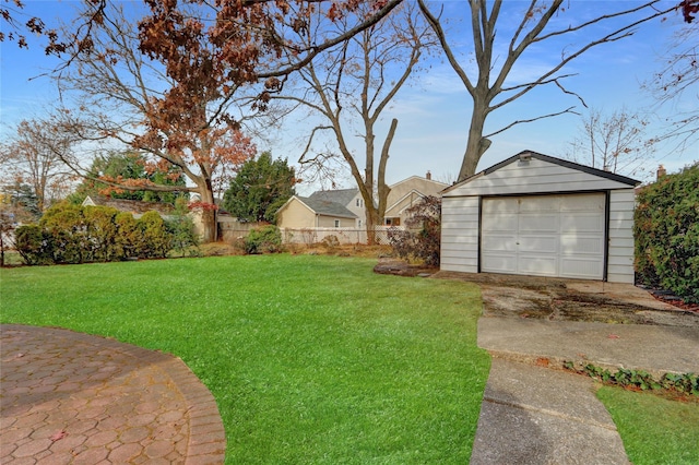 view of yard featuring an outdoor structure and a garage