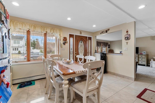 tiled dining room with baseboard heating