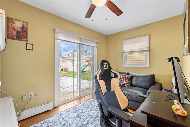 office with ceiling fan, wood-type flooring, and baseboard heating