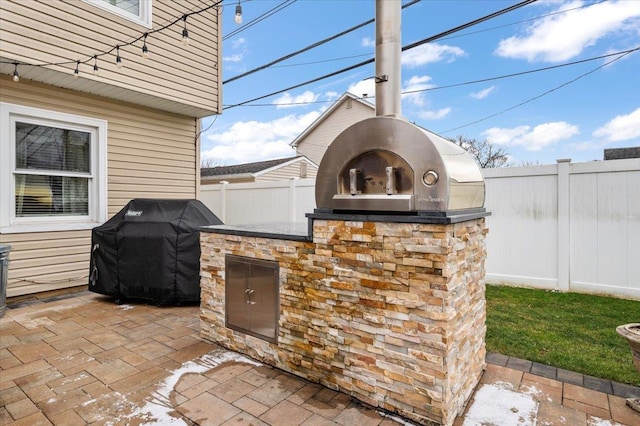 view of patio / terrace featuring exterior kitchen and grilling area