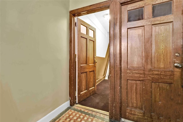 entryway featuring vaulted ceiling