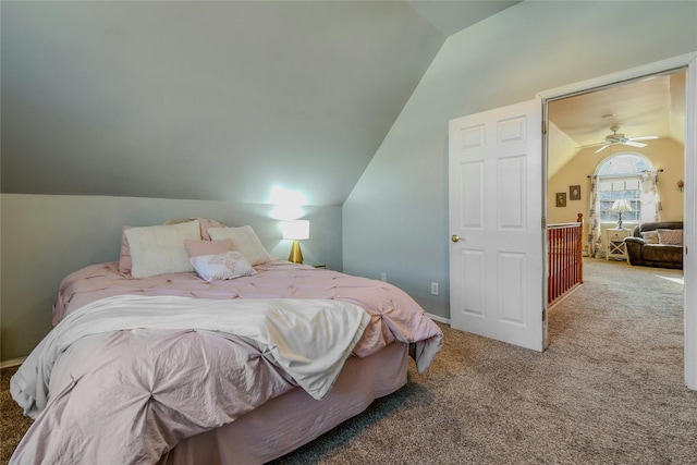 bedroom featuring carpet floors and vaulted ceiling