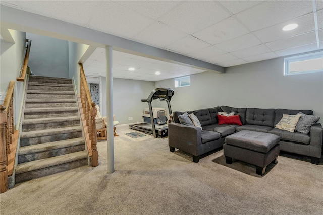 carpeted living room featuring a healthy amount of sunlight and a paneled ceiling