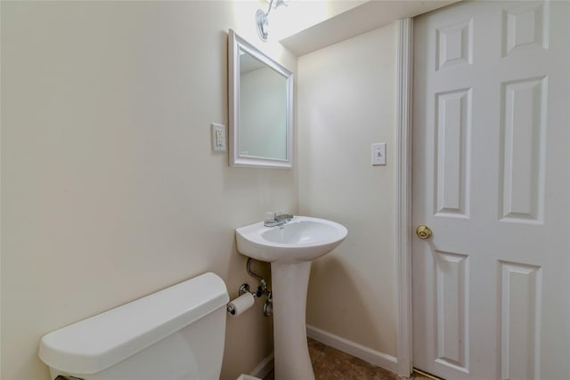 bathroom with toilet and sink