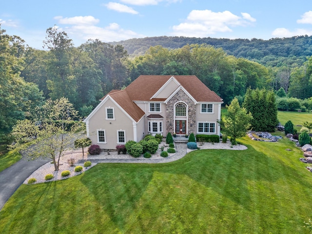 view of front of property with a front lawn