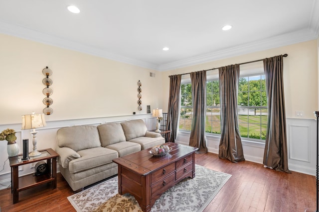 living room with ornamental molding and dark hardwood / wood-style flooring