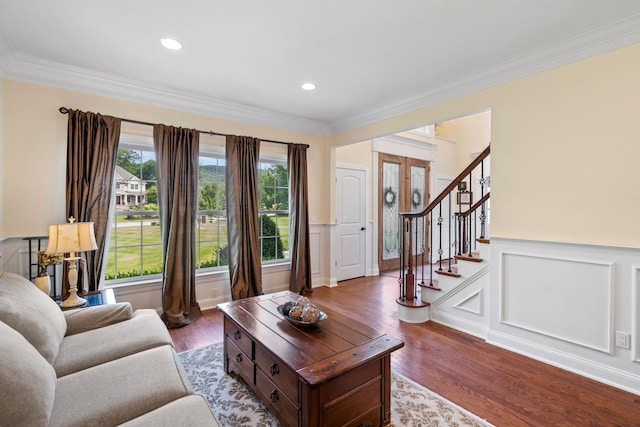 living room featuring hardwood / wood-style floors and ornamental molding