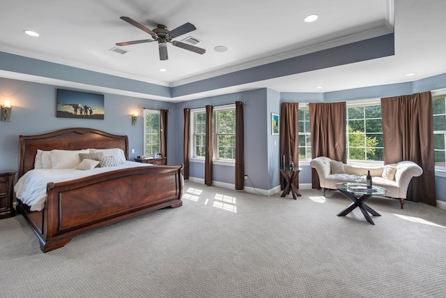 carpeted bedroom featuring crown molding and ceiling fan