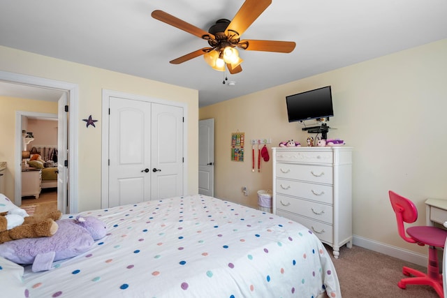 carpeted bedroom with a closet and ceiling fan