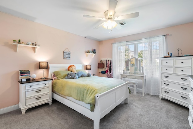 bedroom featuring dark carpet and ceiling fan