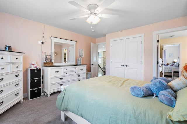 carpeted bedroom with a closet and ceiling fan