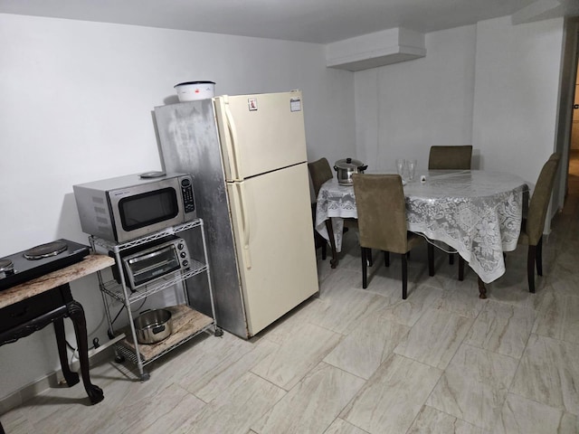 kitchen featuring fridge