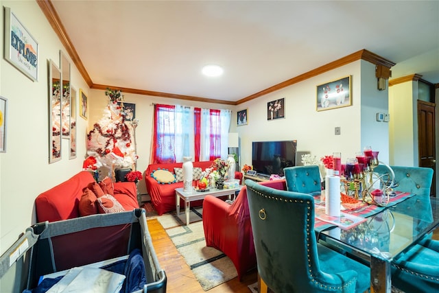 living room with crown molding and hardwood / wood-style flooring