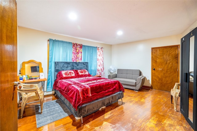 bedroom featuring hardwood / wood-style flooring