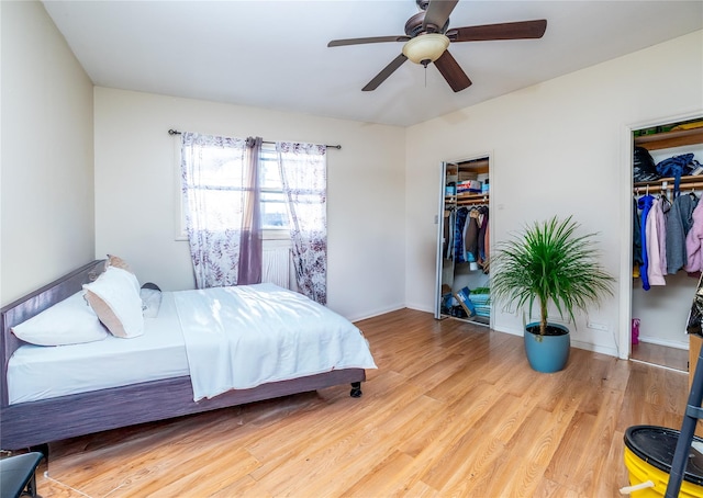 bedroom featuring ceiling fan, a closet, and light wood-type flooring