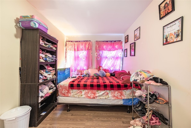 bedroom featuring hardwood / wood-style floors