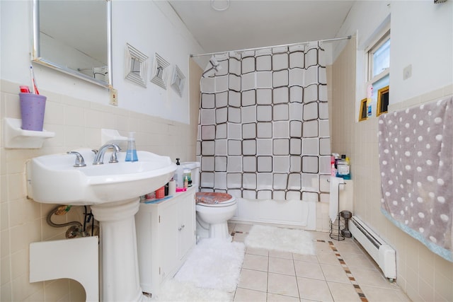 bathroom with shower / bath combo, tile patterned floors, baseboard heating, tile walls, and toilet