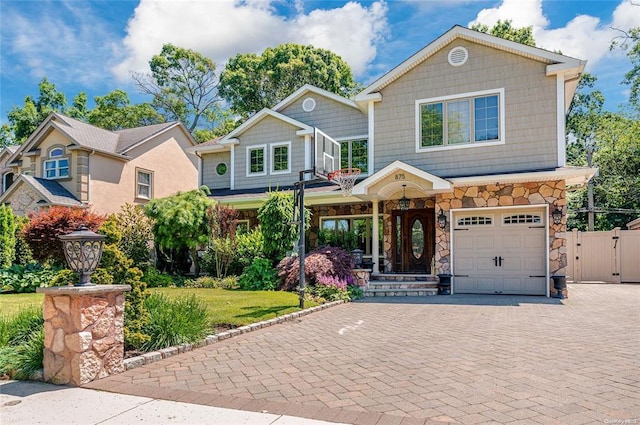 view of front of house with a garage and a front lawn