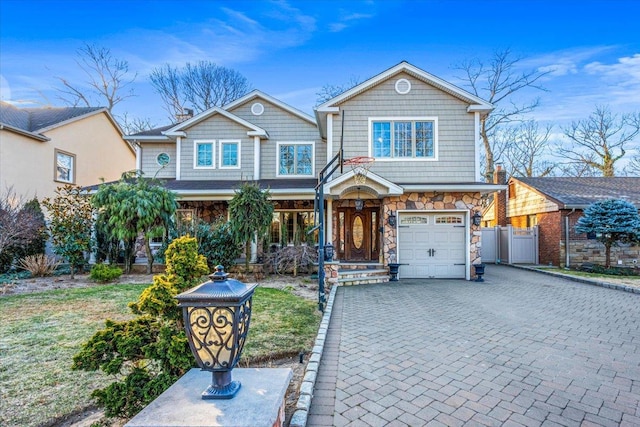 view of front of property with a garage