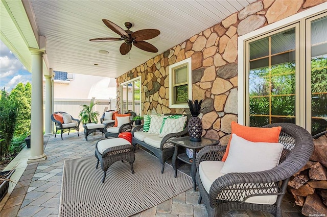 view of patio / terrace featuring ceiling fan and an outdoor living space