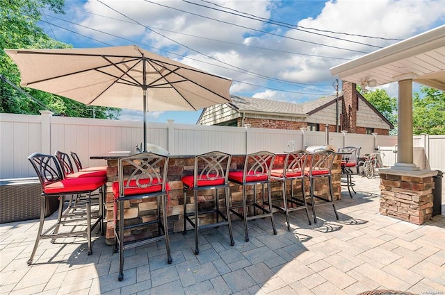 view of patio / terrace featuring exterior bar