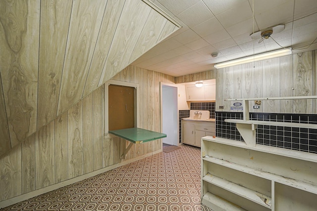 kitchen with wood walls