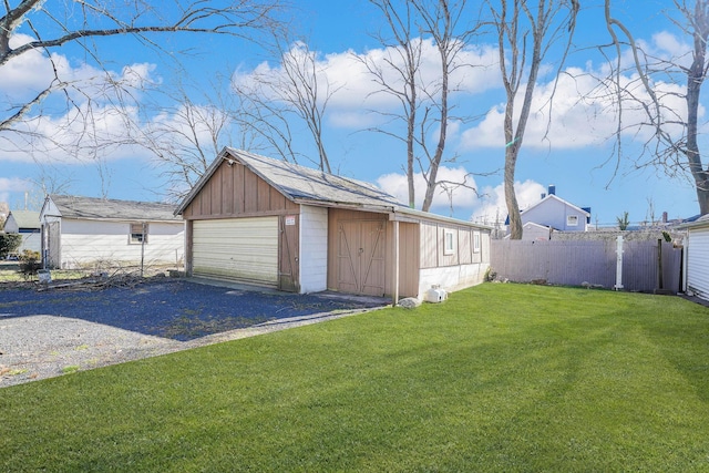 garage with a lawn