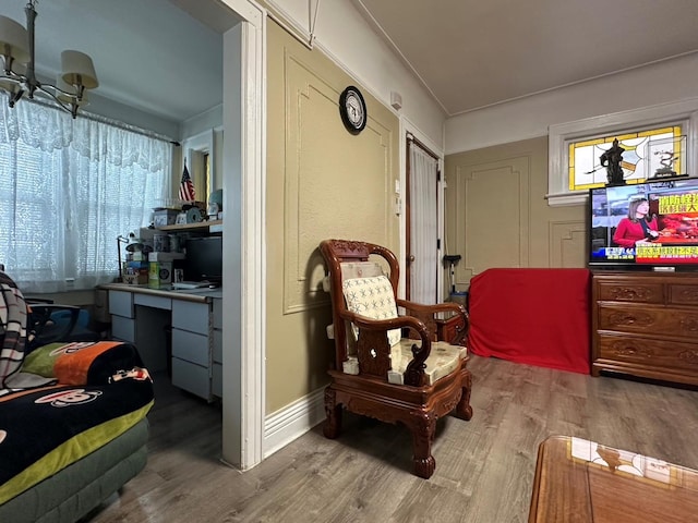 sitting room with hardwood / wood-style flooring